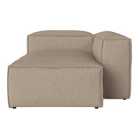 Beige upholstered chaise lounge with a smooth, minimalist design and clean lines. Perfect for modern interiors.