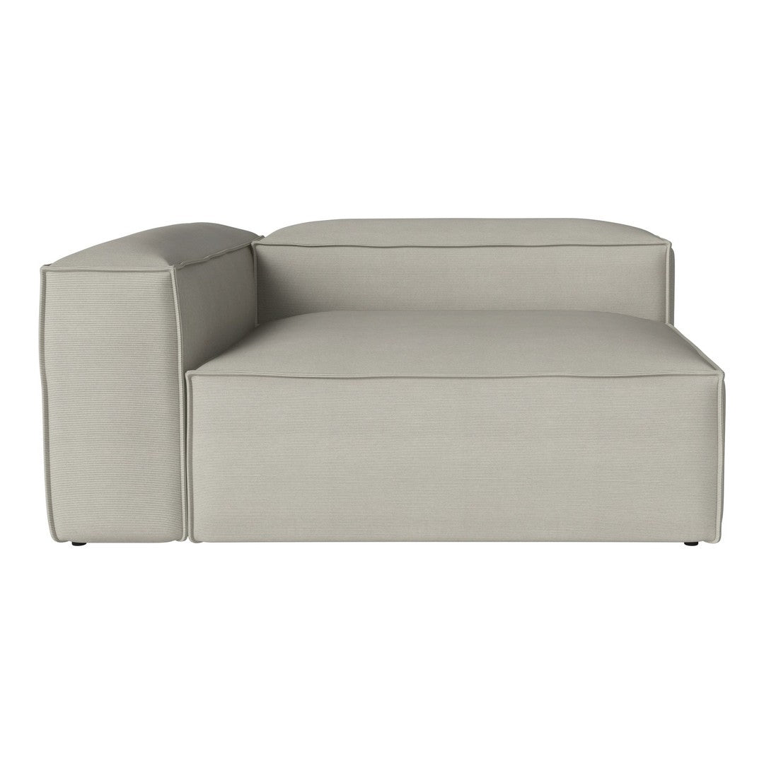 Light gray chaise lounge with a smooth texture and subtle ribbed pattern on the sides. Perfect for modern decor.