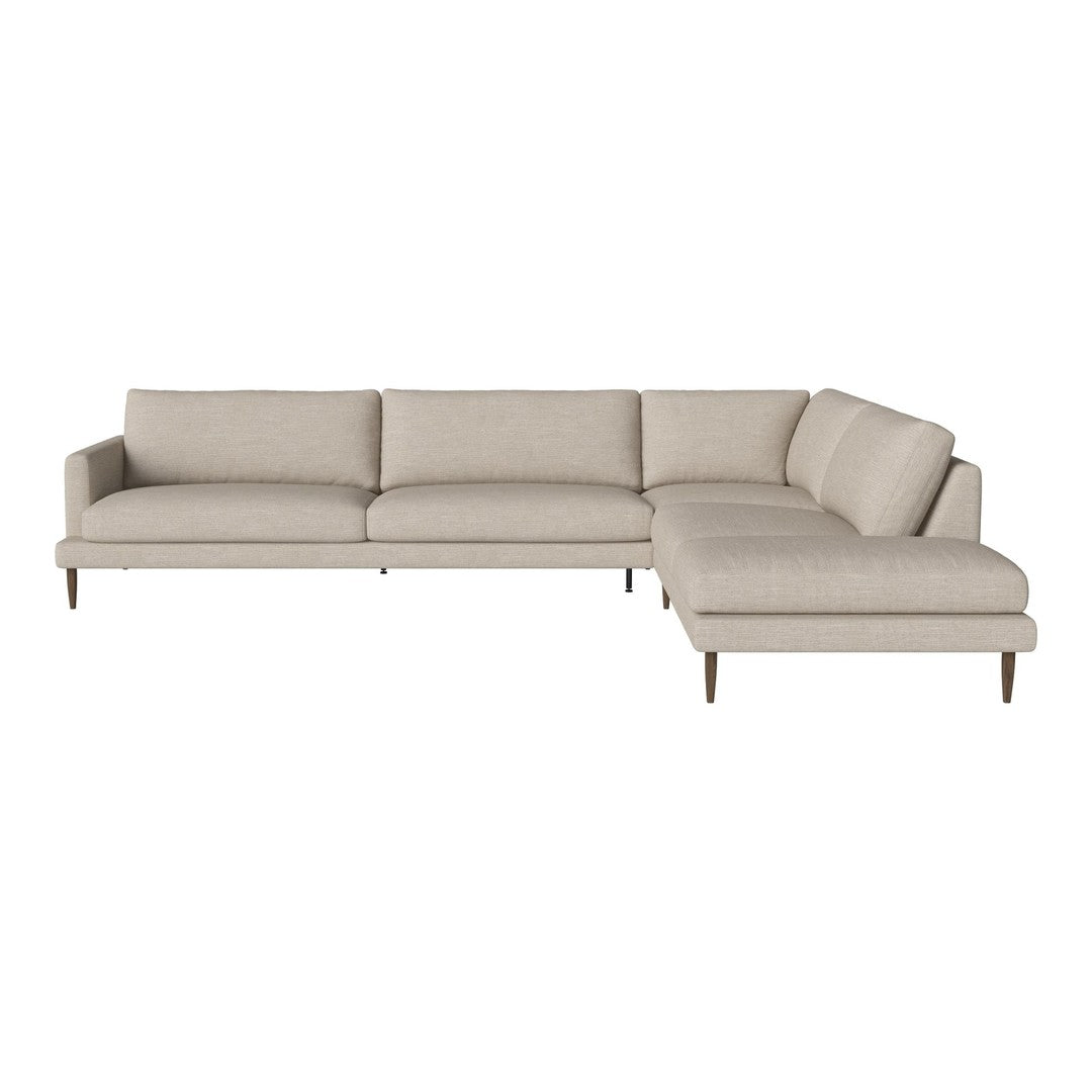 Beige sectional sofa with clean lines and smooth fabric, featuring a minimalist design and tapered wooden legs.