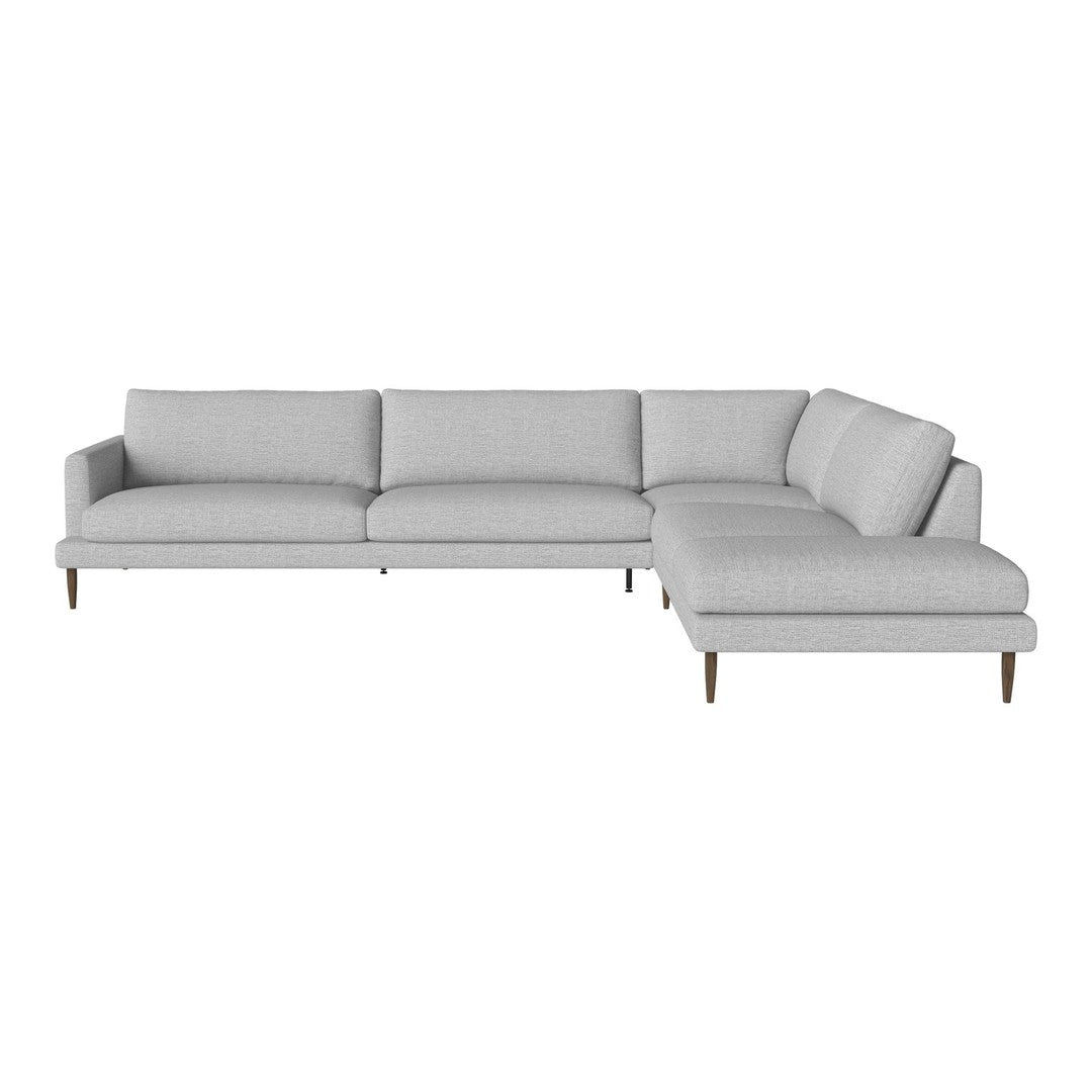 Gray sectional sofa with clean lines and subtle textured fabric, featuring light wood legs for a modern look.
