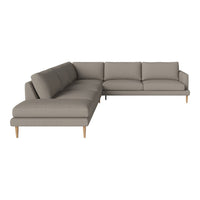 Modern gray sectional sofa with clean lines and soft fabric, featuring a minimalist design and light wood legs.