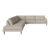"Light beige sectional sofa with a smooth texture and minimalist design, featuring tapered wooden legs."