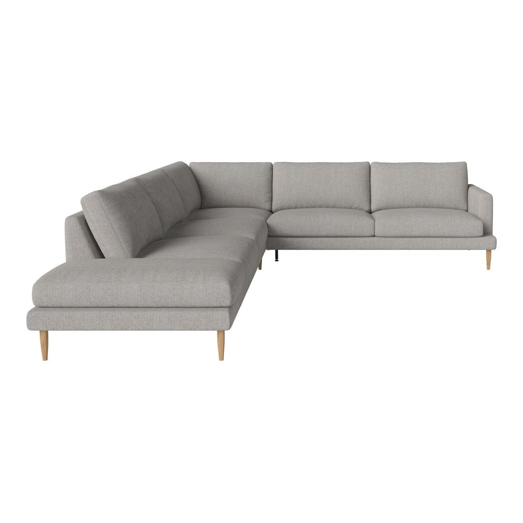 Light grey sectional sofa with clean lines and smooth upholstery, featuring minimalist design and wooden legs.