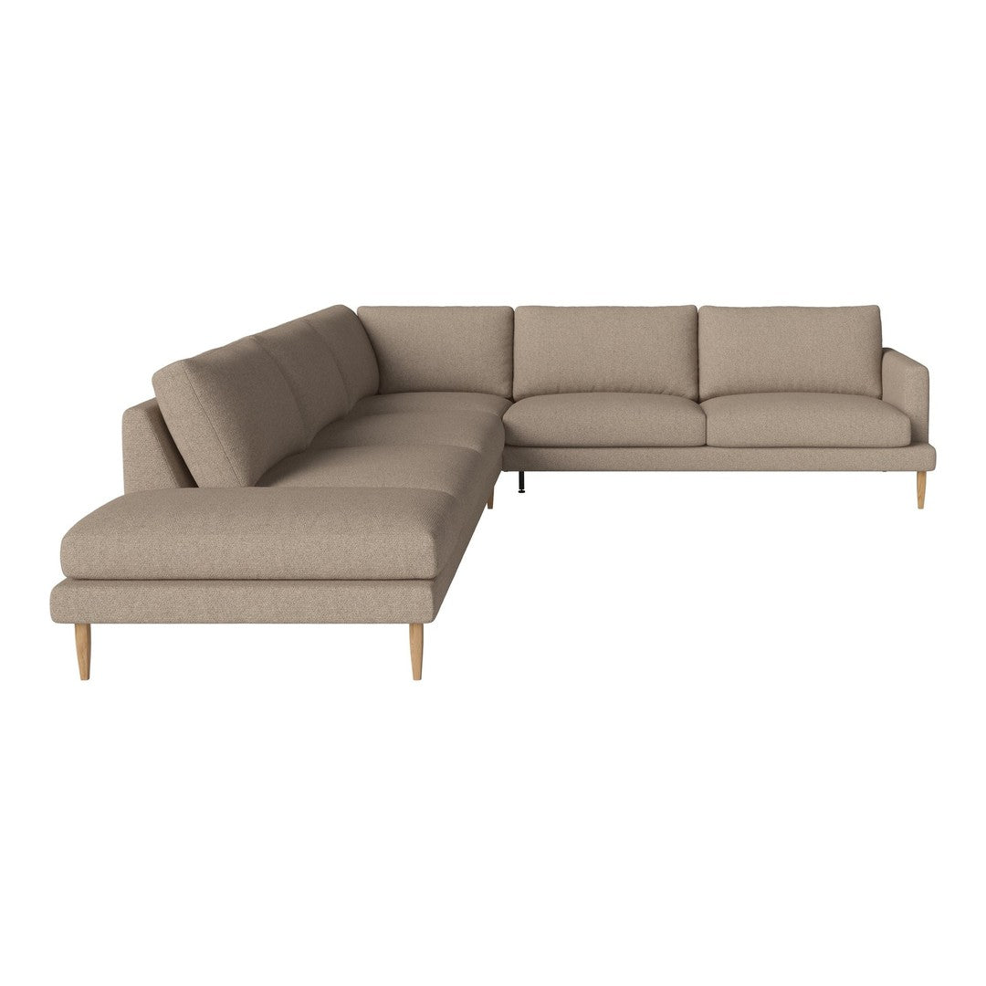 Beige sectional sofa with a smooth fabric texture and minimalist design, complemented by light wooden legs.