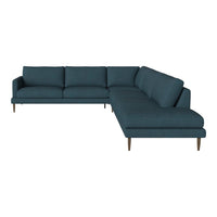 Teal sectional sofa with a minimalist design and solid texture, featuring angled wooden legs for a modern touch.