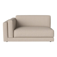 Beige upholstered one-arm sofa with a soft, textured fabric, offering a minimalist design and modern aesthetic.