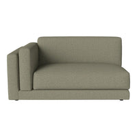 Green textured fabric sectional sofa with a sleek, modern design and square armrest. Ideal for contemporary decor.