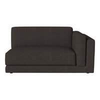 Charcoal gray upholstered sofa with a sleek, modern design, featuring smooth, textured fabric and minimalist lines.