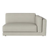 Light beige sofa with subtle ribbed pattern, featuring a modern, minimalist design and sleek lines.