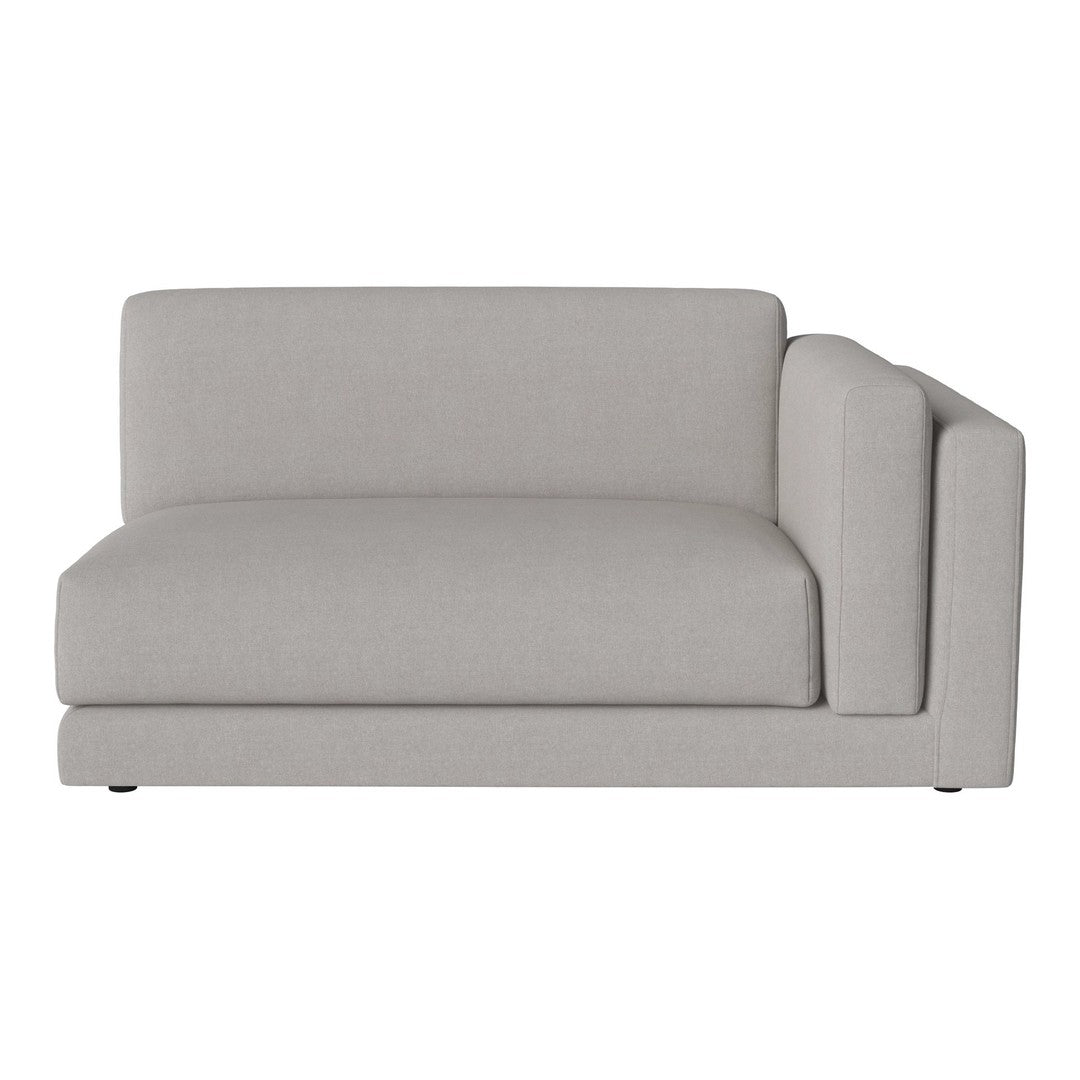 Light gray sectional sofa with a minimalist design, featuring smooth, soft fabric and clean lines.