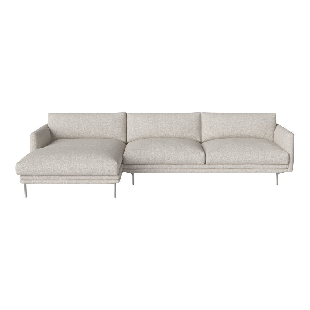 Light beige sectional sofa with smooth, clean lines and plush cushions on sleek metallic legs.