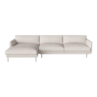Light beige sectional sofa with smooth upholstery and minimalist silver legs, featuring a modern, clean design.