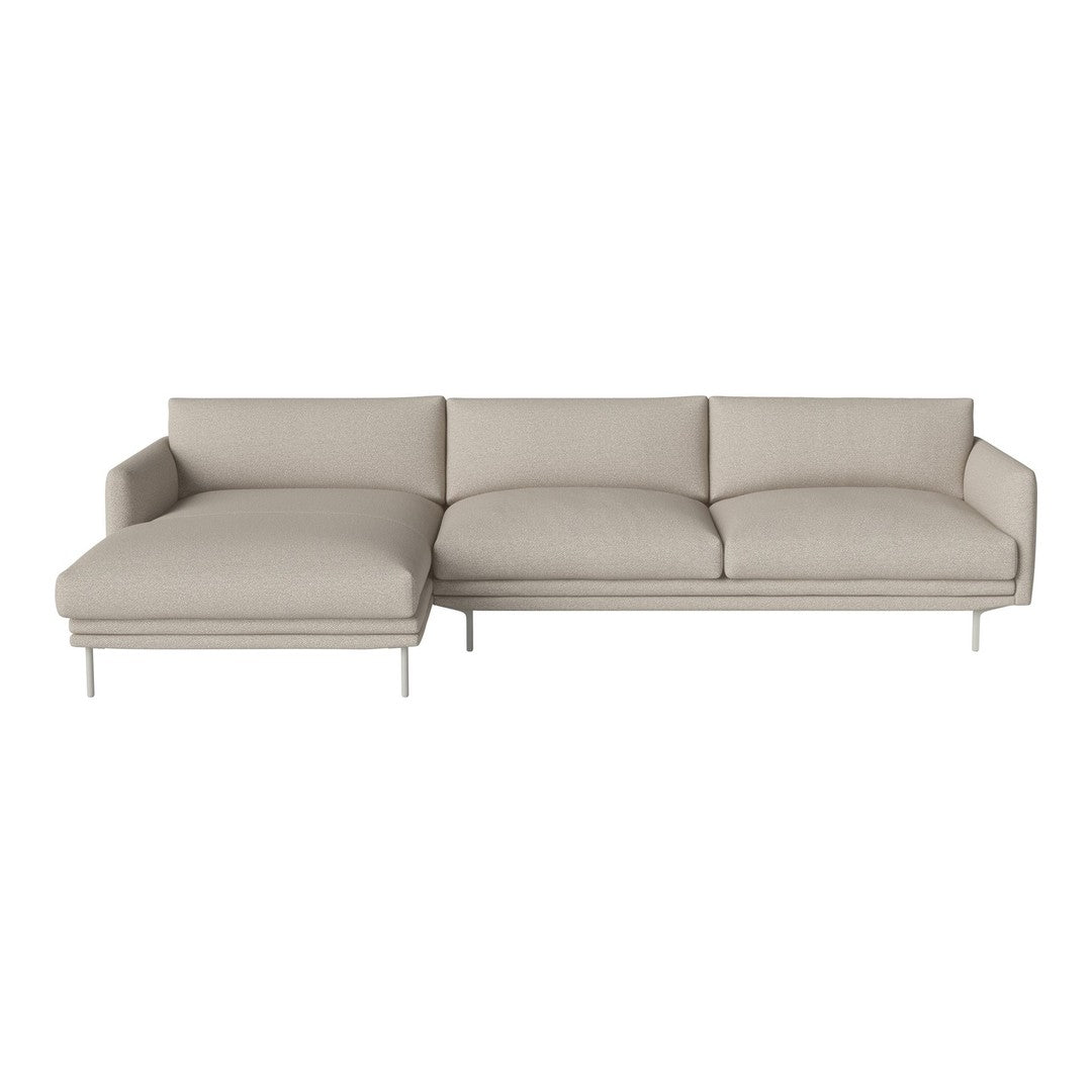 Light beige sectional sofa with plush cushions and sleek metal legs, showcasing a minimalist design.