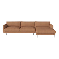 Rust-colored modern sectional sofa with a textured fabric and clean lines, featuring a sleek black metal base.