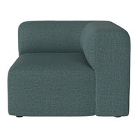 Teal textured fabric armchair with a modern, sleek design and minimalist pattern, perfect for contemporary spaces.
