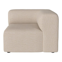 Beige textured sofa section with a modern minimalist design featuring smooth, rounded edges.