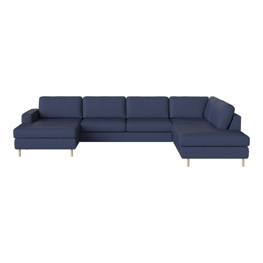 Navy blue sectional sofa with clean lines and modern design, featuring textured fabric and light wood legs.