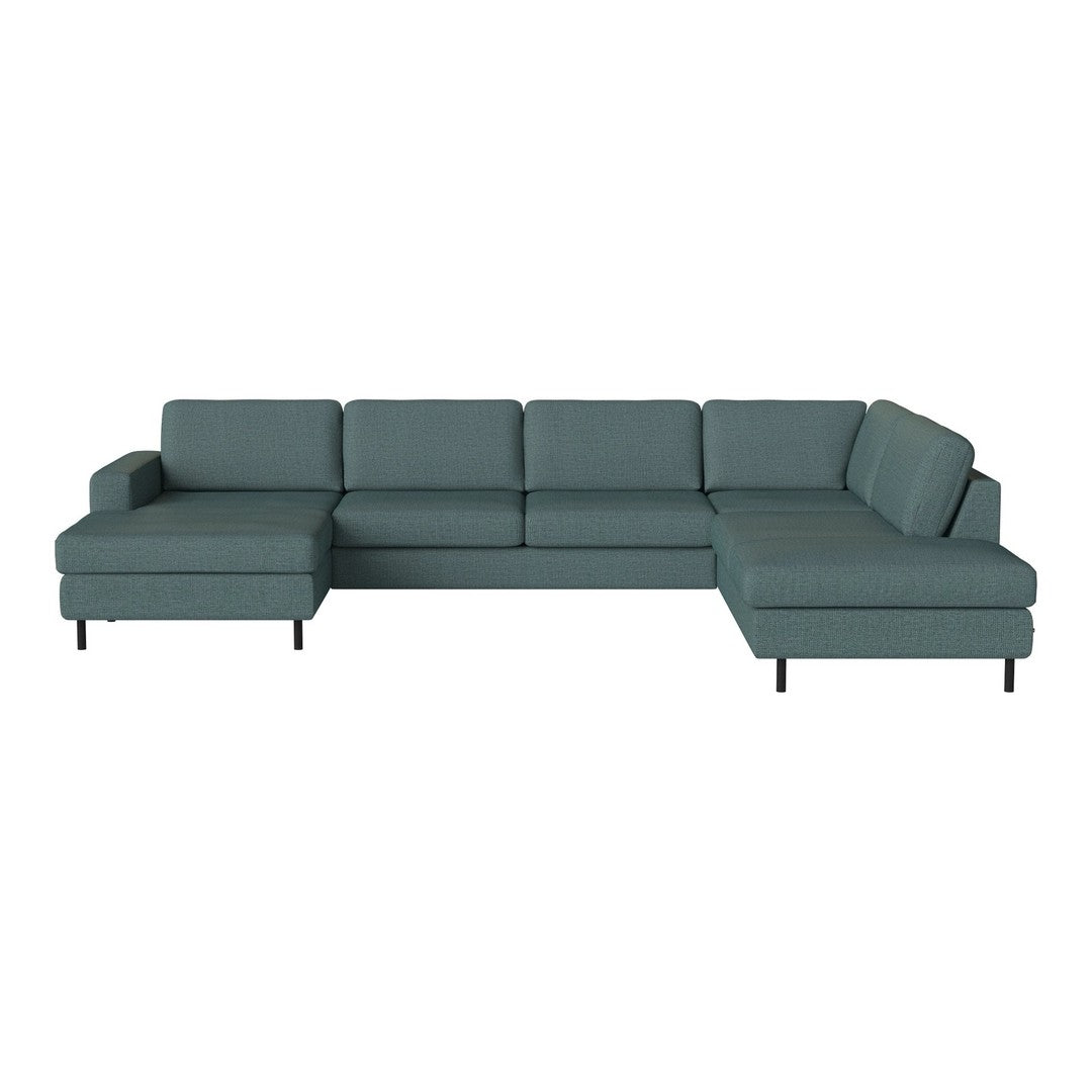 Teal sectional sofa with a minimalist design and clean lines, featuring a solid color and no patterns.