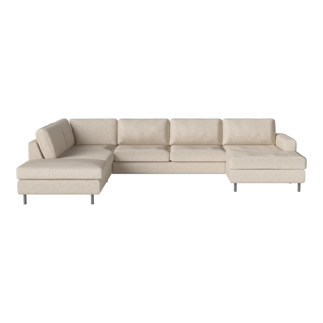 Beige sectional sofa with modern, clean lines and a soft, minimalist design, featuring a smooth texture and metal legs.