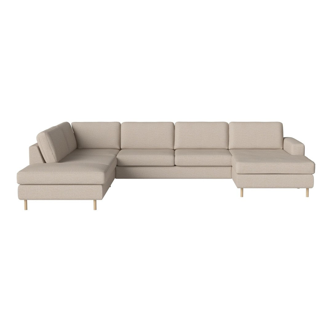 Beige sectional sofa with clean lines and minimalistic design, featuring solid fabric upholstery and light wooden legs.