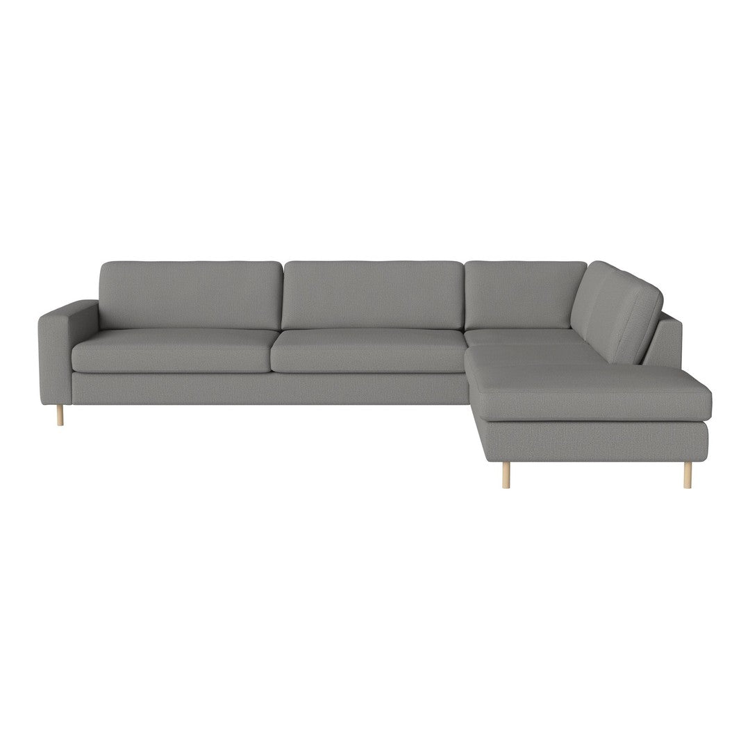 Gray sectional sofa with a minimalist design and simple lines, featuring solid color upholstery and wooden legs.
