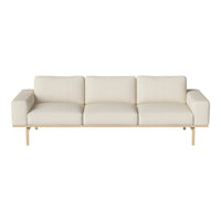 Light beige three-seater sofa with a minimalist design and smooth fabric, featuring a sleek wooden base.