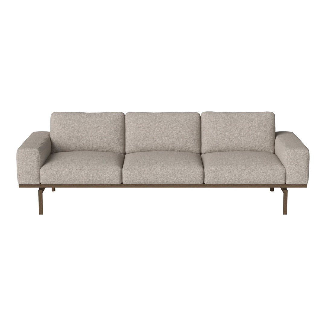 Light beige sofa with a minimalist design and smooth fabric upholstery, complemented by a sleek wooden frame.