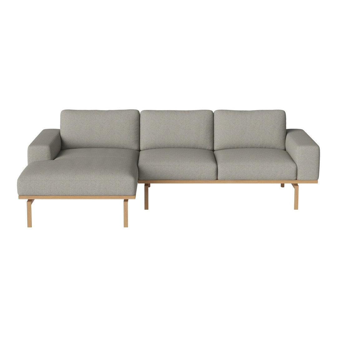 Gray modern sectional sofa with clean lines and subtle textured fabric, complemented by natural wood legs.