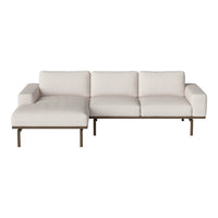 Light beige sectional sofa with a minimalist design and clean lines, featuring a soft, textured fabric.