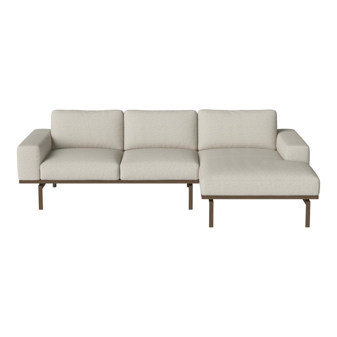 Modern beige sectional sofa with minimalist design and smooth, neutral upholstery, perfect for contemporary living spaces.