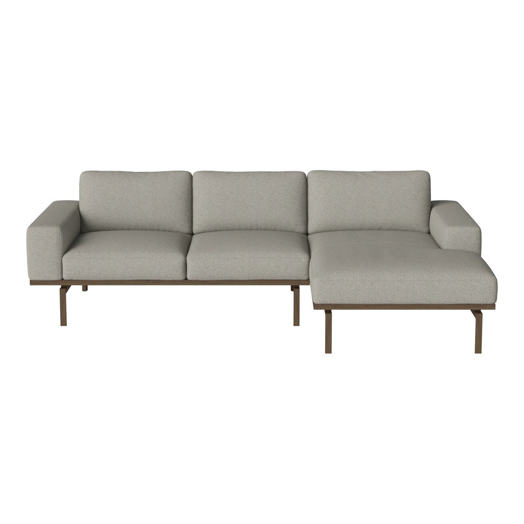 Light gray fabric sectional sofa with clean lines and a minimalist design, featuring soft cushions and a sleek metal frame.