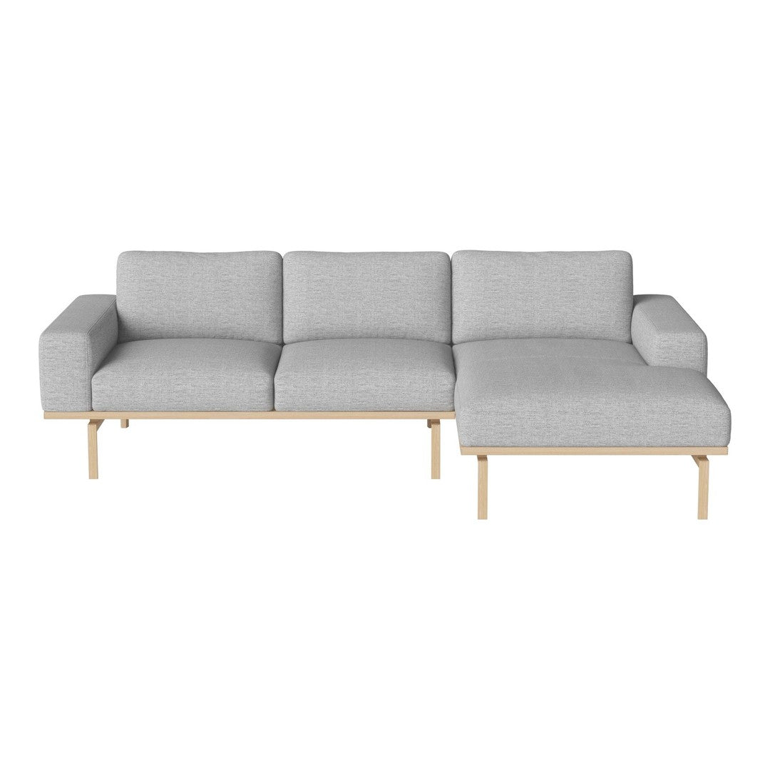 Light gray fabric sectional sofa with clean lines and natural wood legs, perfect for modern living spaces.
