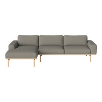 Gray sectional sofa with a minimalist design and light wooden legs, featuring a smooth fabric texture.
