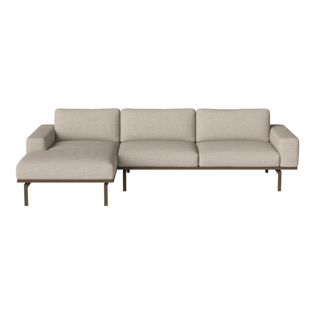 Light beige sectional sofa with clean lines and a minimalist design, featuring a solid metal frame and no distinct patterns.