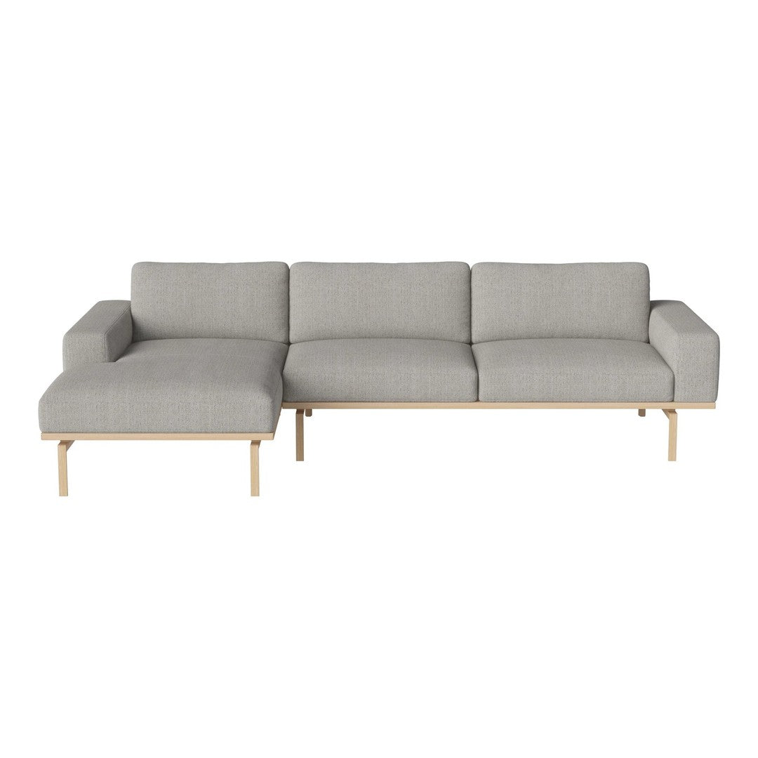 Light gray fabric sectional sofa with subtle textured pattern and natural wood legs. Modern design for stylish living spaces.