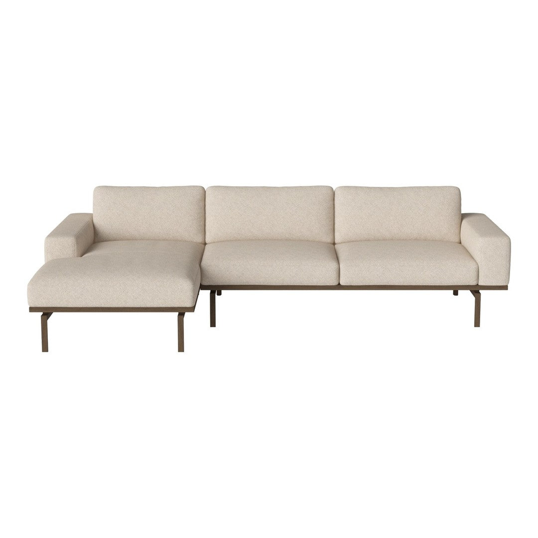 Beige sectional sofa with a modern design and smooth, textured fabric against a sleek metal frame.