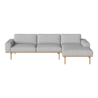 Modern gray sectional sofa with sleek lines and light wooden legs, perfect for contemporary living spaces.