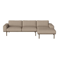 Beige modular sofa with clean lines and a simple, minimalist design featuring a comfortable chaise section.