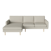 Light gray modern sectional sofa with clean lines and soft fabric, featuring a minimalist design and wooden legs.