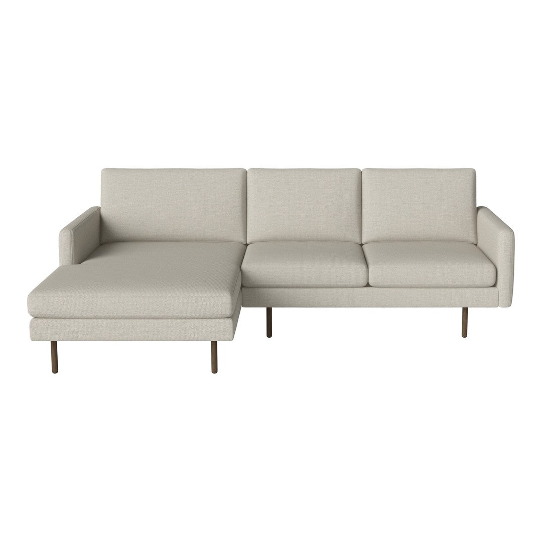 Light beige sectional sofa with sleek lines and a minimalist design, featuring smooth upholstery and metal legs.