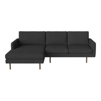 Modern dark gray sectional sofa with clean lines and textured fabric. Perfect for contemporary living spaces.