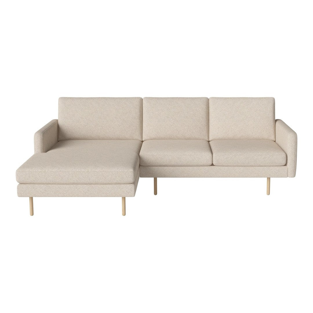 Beige sectional sofa with a simple, textured pattern and light wood legs, perfect for modern living spaces.