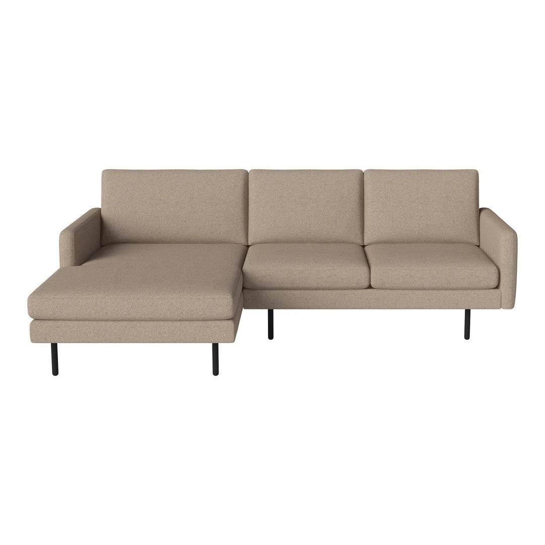 Beige fabric sectional sofa with clean lines and modern design, featuring a plush chaise lounge and minimalistic black legs.