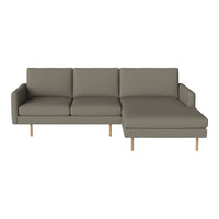 Grey sectional sofa with clean lines and wooden legs, perfect for modern decor. Simple and stylish design.