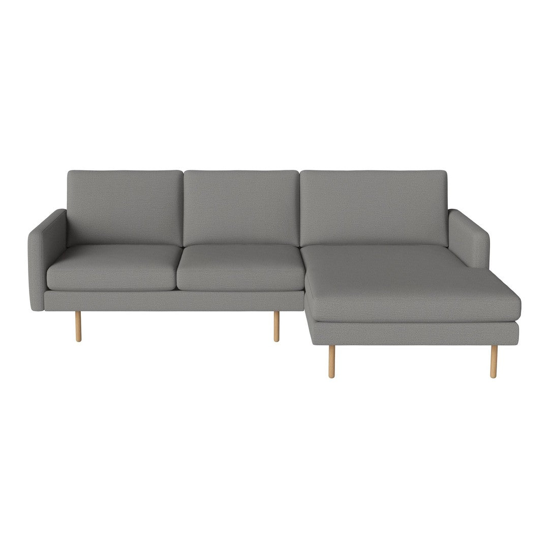 Modern gray sectional sofa with clean lines and wooden legs. Stylish and versatile for any living space.