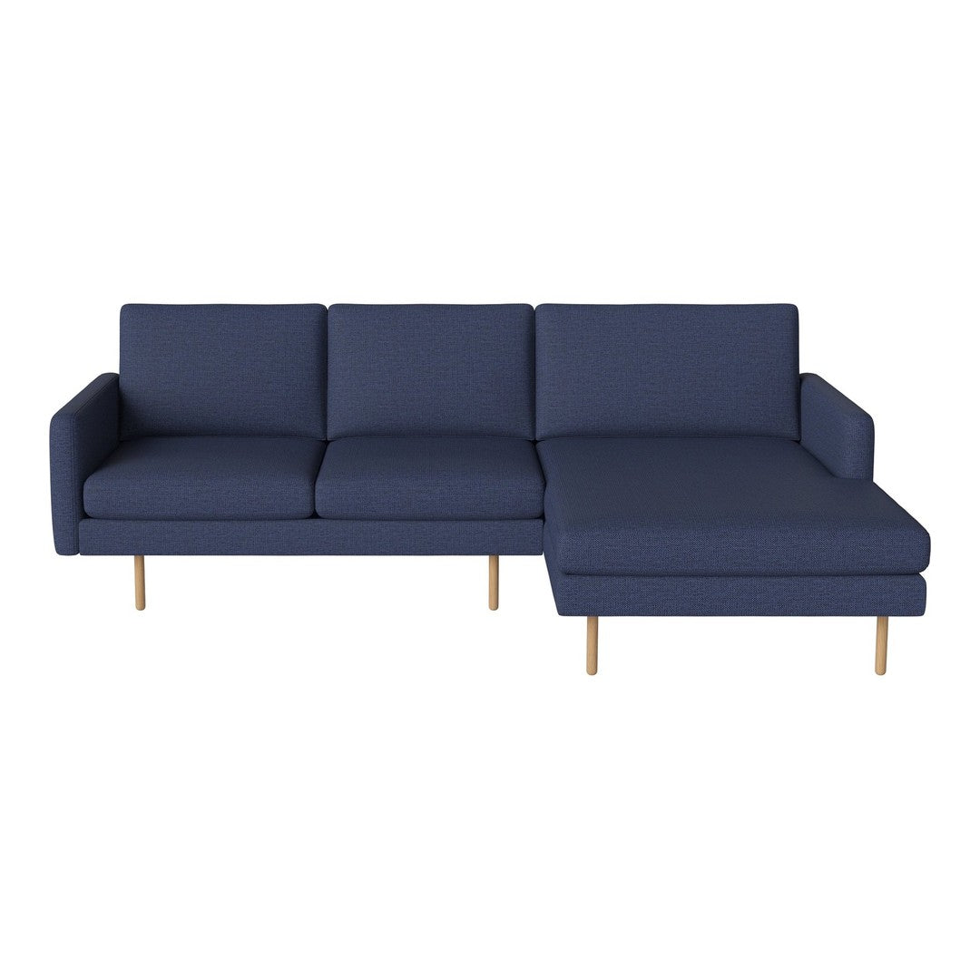 Navy blue sectional sofa with clean lines and wooden legs, perfect for modern living spaces.
