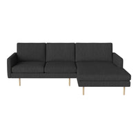 Grey fabric sectional sofa with clean lines and wooden legs, featuring a modern, minimalist design for stylish living spaces.
