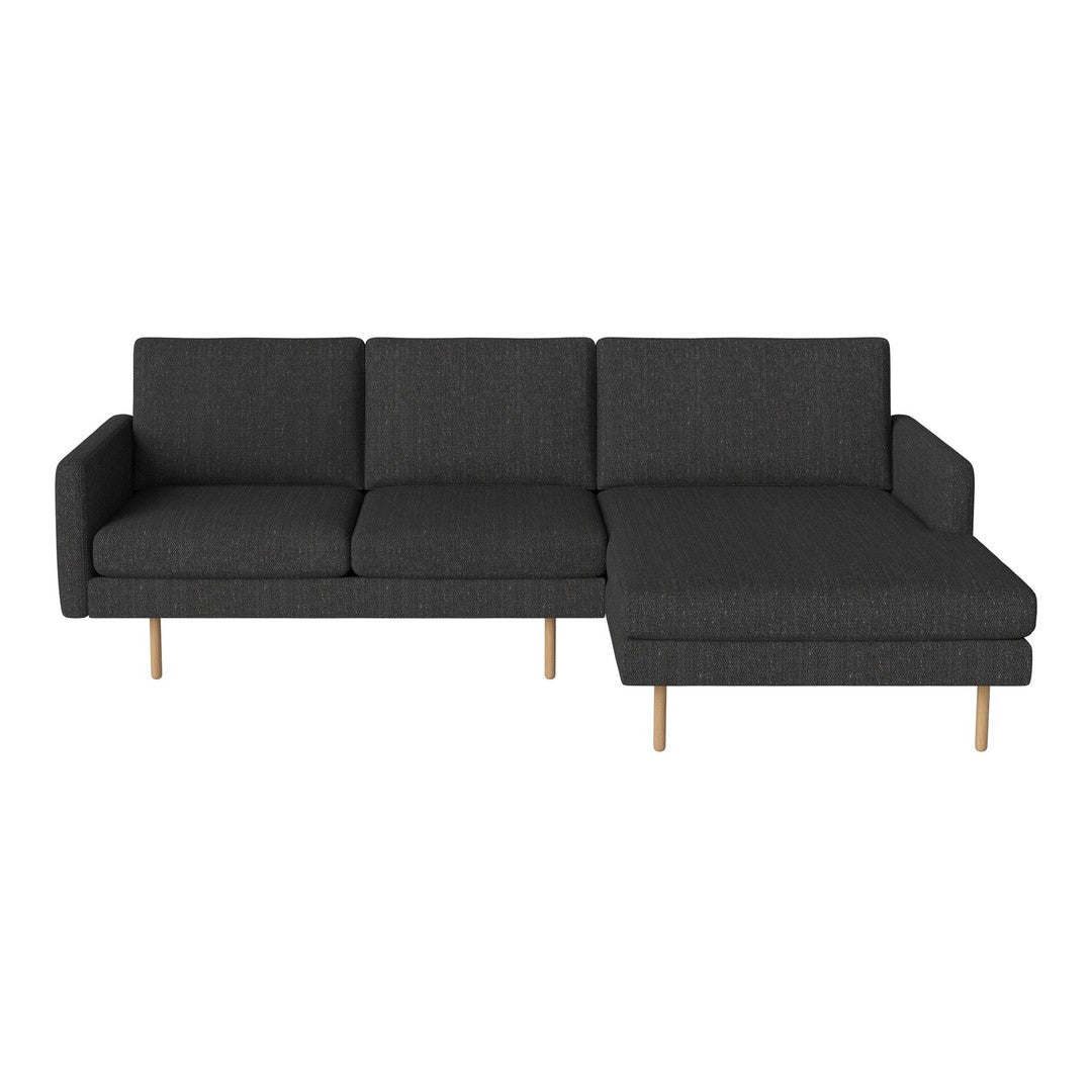 Modern dark gray fabric sofa with clean lines and wooden legs, featuring a minimalist design and chic style.