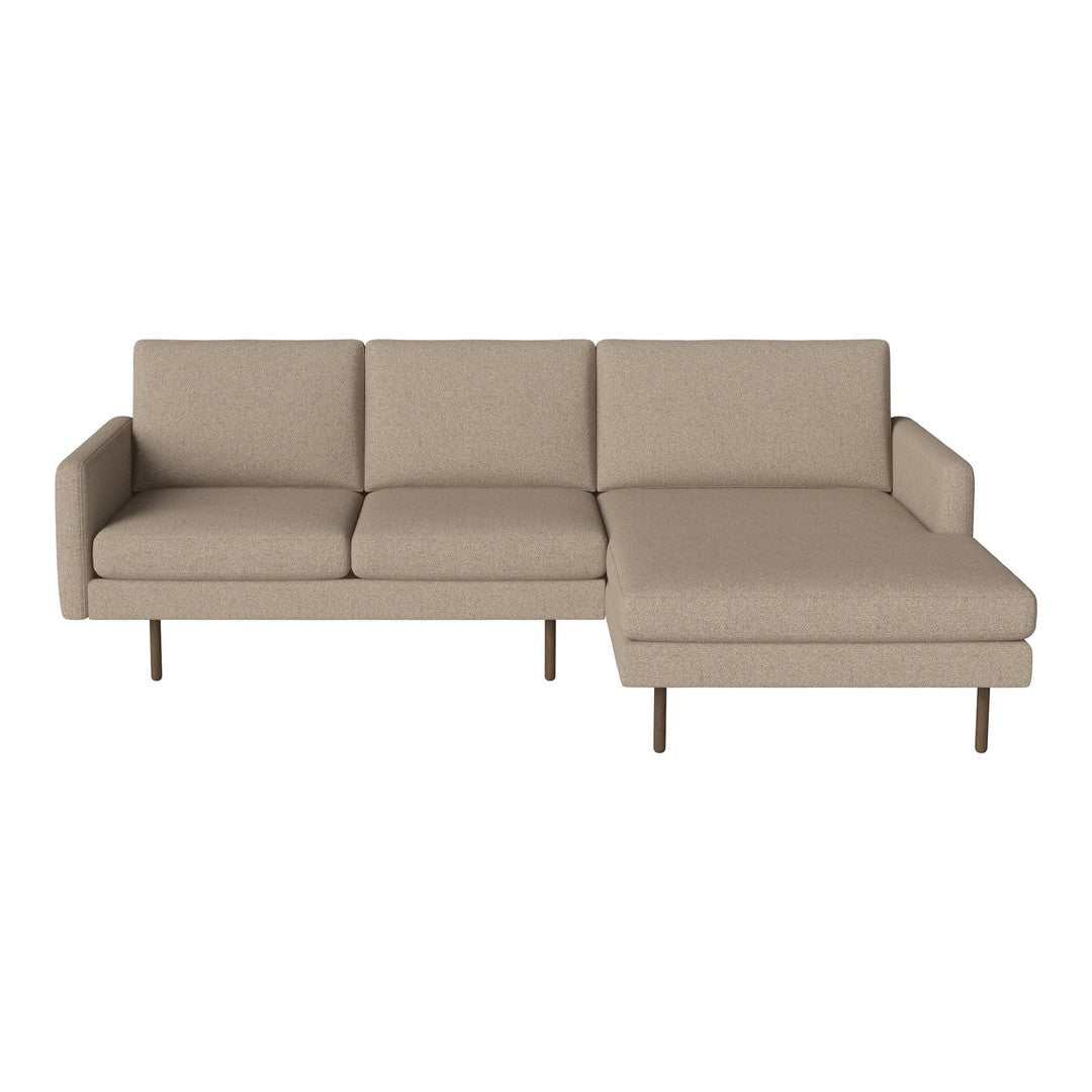 Beige sectional sofa with a minimalist design and clean lines, featuring smooth upholstery and sturdy metal legs.