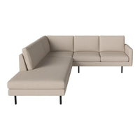 Beige sectional sofa with clean lines and no visible patterns on minimalist frame. Ideal for modern decor.
